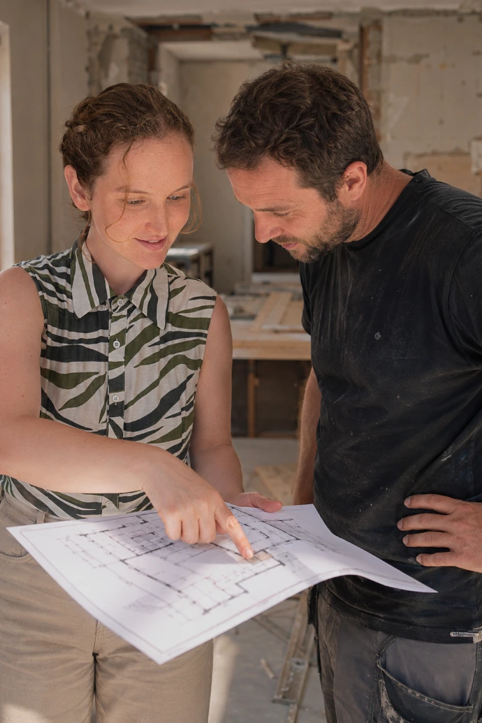 interior designer looking over a plan